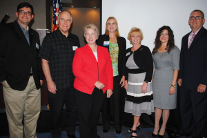 Houston Mayor Annise Parker, third from left, stops for a photo with Clear Lake Area Chamber officials including, from left, Chairman Jamieson Mackey, Good Shepherd Church Pastor Dr. Jan Sattem, Business Division Chairman Janette Alford, President and CEO Cindy Harreld, Program Chairman Charity Ellis and Stuart Cayer of luncheon sponsor Kelsey-Seybold Clear Lake.