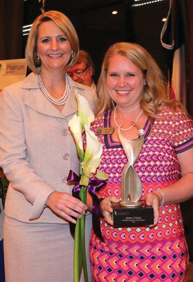 Erika Steele, right, is presented the 2016 Athena Leadership Award by Jill Kaiser, chairman of the League City Regional Chamber Board of Directors.