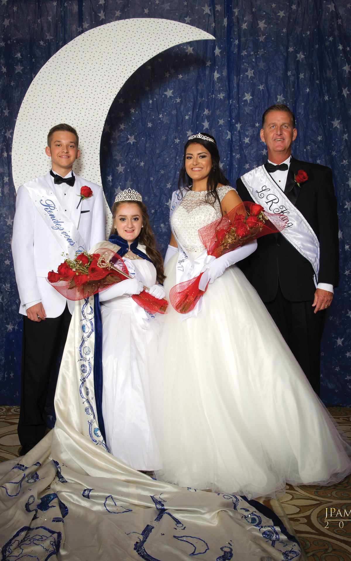 2017 Lunar Rendezvous Queen Madelyn Claire Emilia Chidester poses for a photo with King Kevin Duke, right, Queen Alternate Alexa Rae Trevino and Captain Alexander Edward Struss at the Coronation Ball in Galveston. They will reign over next year’s festival. Photo by J. Pamela Photography