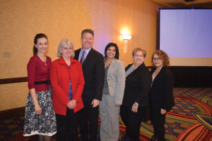 2014 Economic Alliance staff. From left to right: Michelle Hundley, VP of Public Affairs; Marie McDermott, VP of Business Development; Chad Burke, President/CEO; Marisela Cantu, Event & Membership Services Coordinator; Bridget Yeary, Administrative & Financial Manager; and Tamara Nicholl-Smith, Director of Communications.