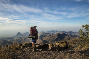 A hiker overlooks the terrain at Big Bend National Park.