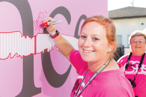 Dana Tegeler, athletic trainer at Clear Creek High School, was among the first to sign the “Strike Through Cancer Wall” during Clear Creek High School’s football game against Brazoswood on Oct. 9.